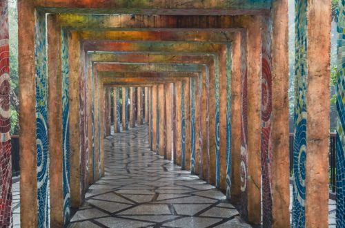 A vibrant mosaic corridor with geometric paving stones in Ba Na Hills, Vietnam.