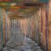 A vibrant mosaic corridor with geometric paving stones in Ba Na Hills, Vietnam.